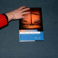 Demonstrating that rotation doesn't commute in three dimensions.