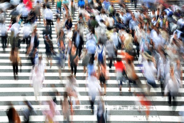 Blurred people at a pedestrian crossing