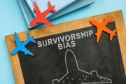 Chalkboard saying Survivorship bias, surrounded by little planes