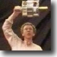 Man holding gyroscope over his head